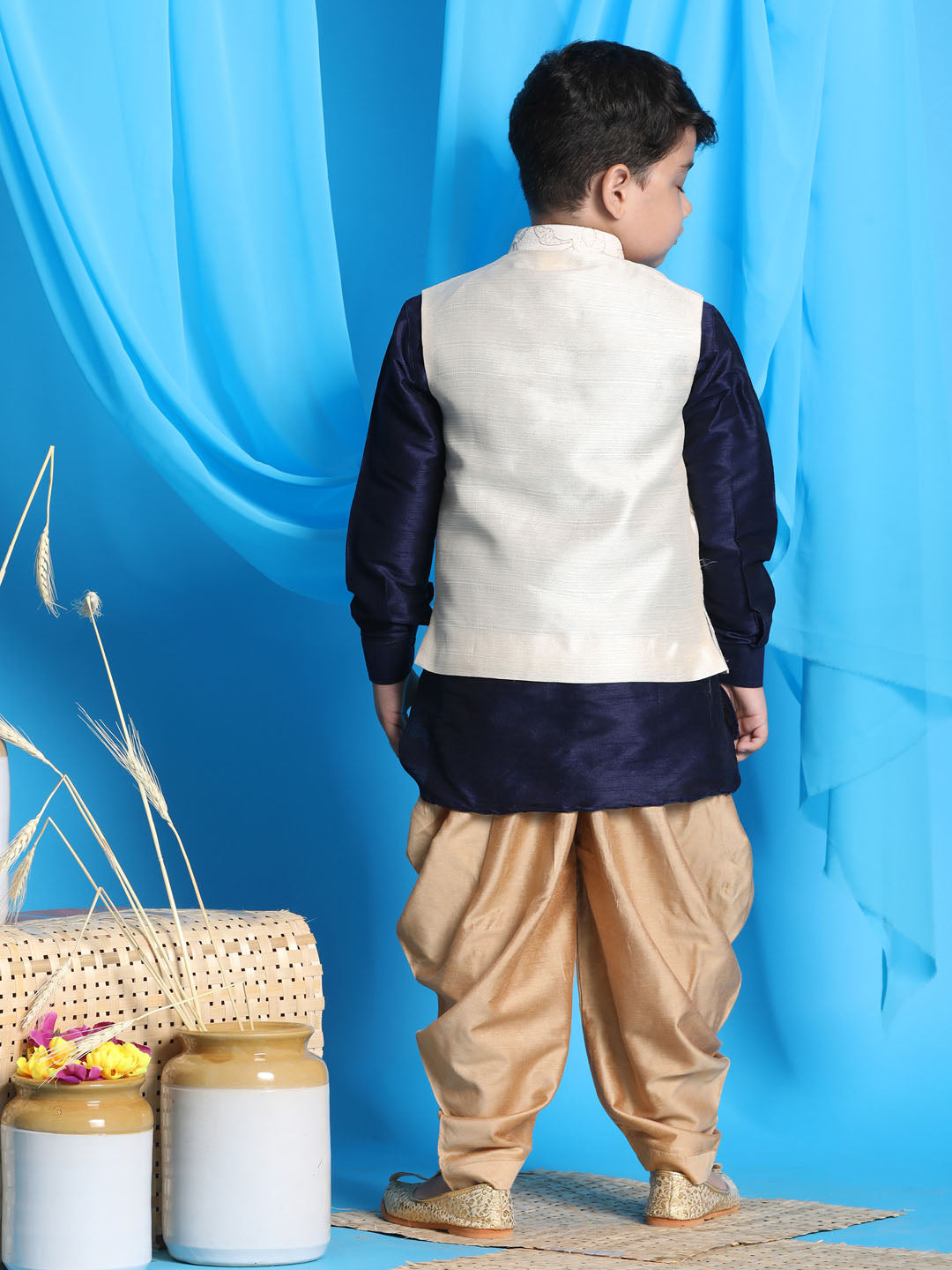 Vastramay Boy's Beige Embroidered Nehru Jacket With Navy Blue Kurta And Rose Gold Dhoti Set