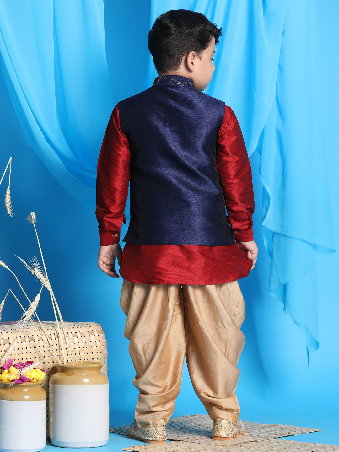 Vastramay Boy's Navy Blue Embroidered Nehru Jacket With Maroon Kurta And Rose Gold Dhoti Set