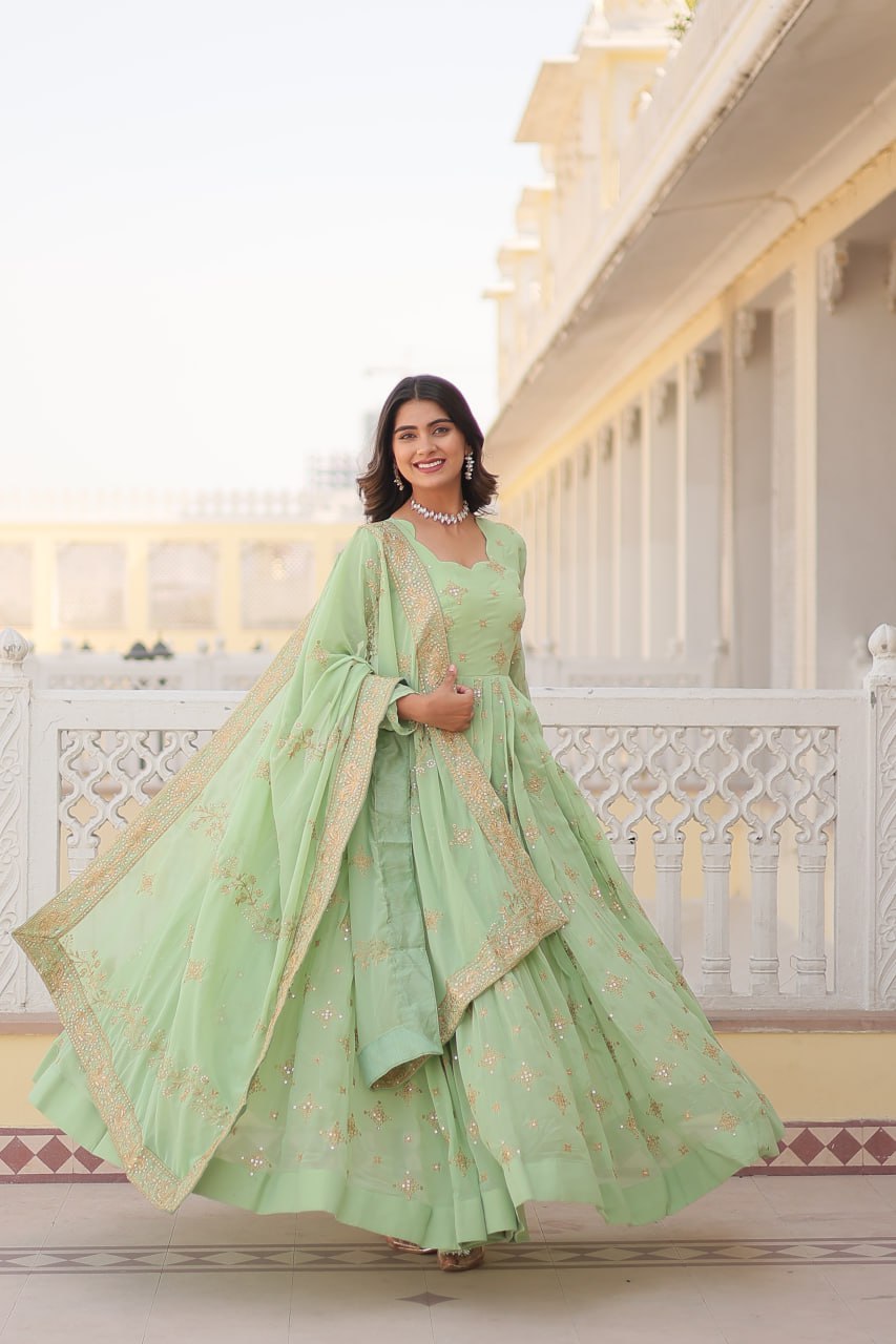 Pista green Georgette gown with intricate zari and sequins embroidery