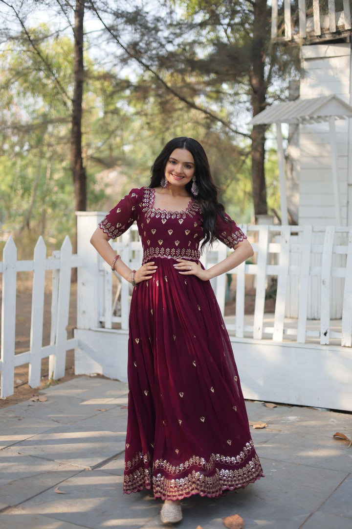 Beautiful wine-colored faux bloom with intricate embroidery and Zari sequins work