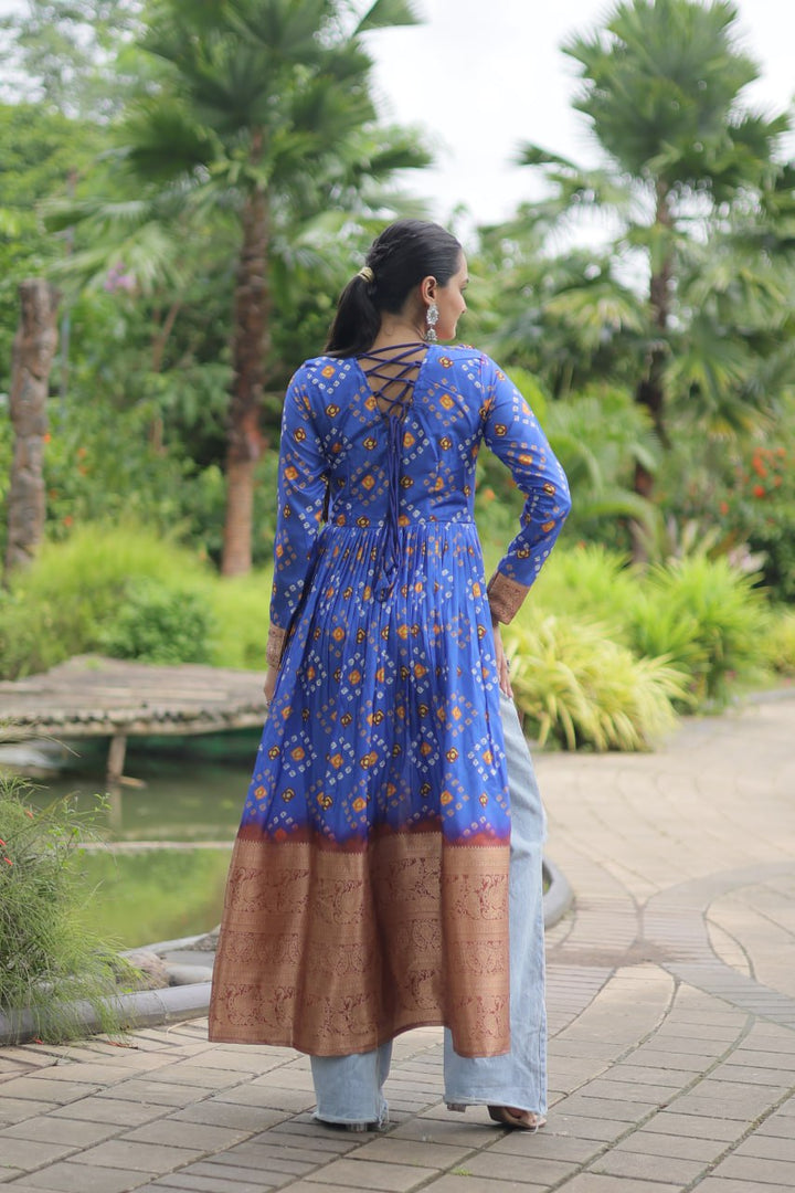 Blue color printed cotton fabric featuring intricate Kutchi Gamthi work and adorned with delicate Kodi lace detailing