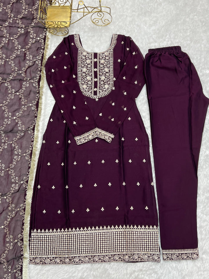 Exquisite wine color silk fabric with stunning thread work and embroidery on yoke, sleeves, and round neckline