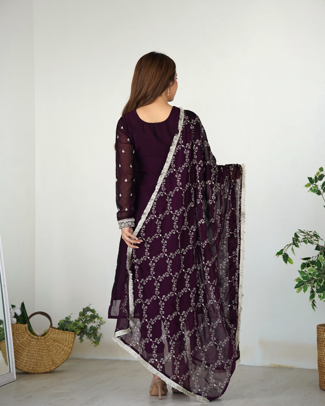 Elegant wine color silk fabric with intricate embroidery and sequin work on yoke, sleeves, and bottom lace