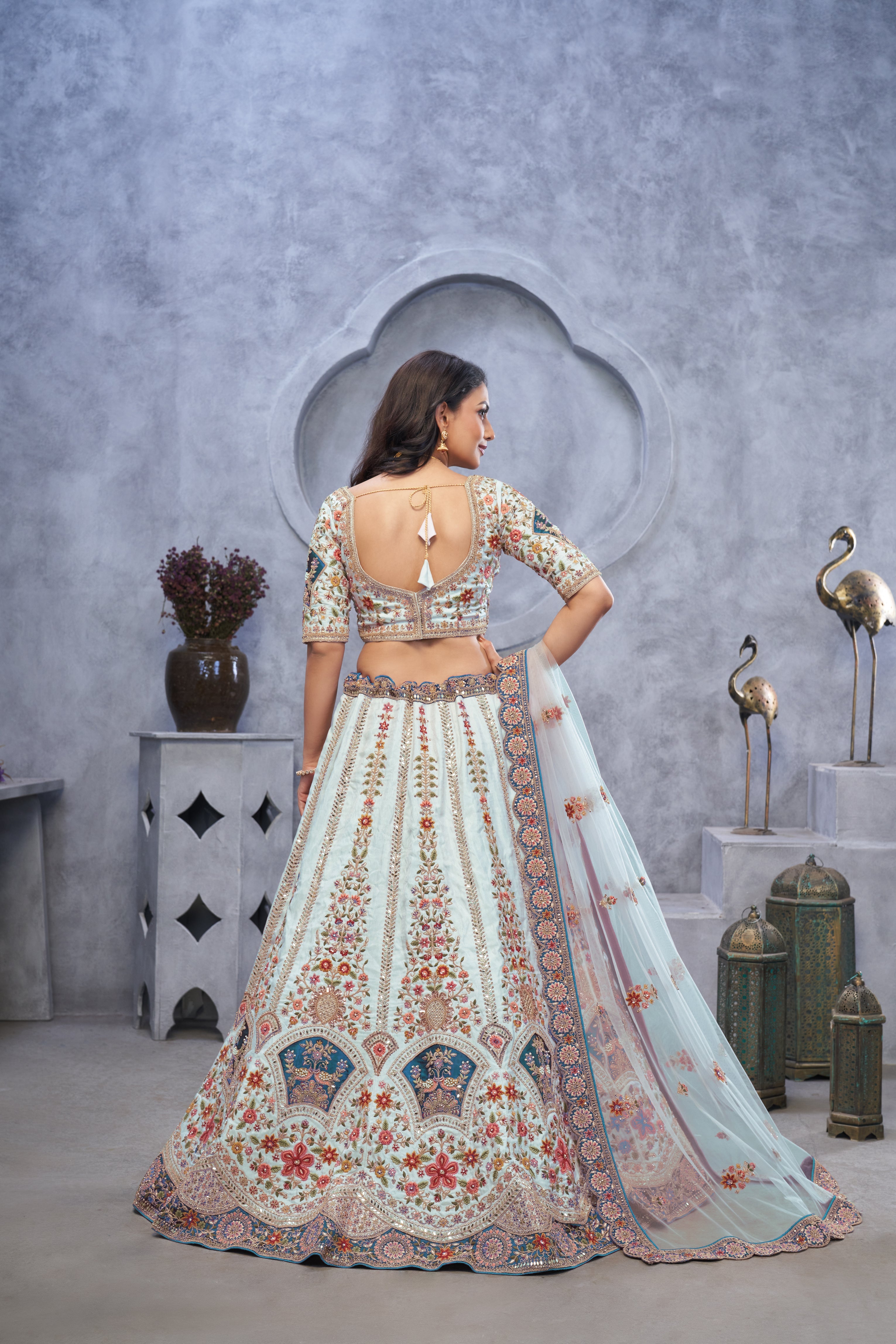 Stunning Sky Blue Lehenga with Zari Paisley Embroidery, Silk Patches, and Peacock Motifs - qivii