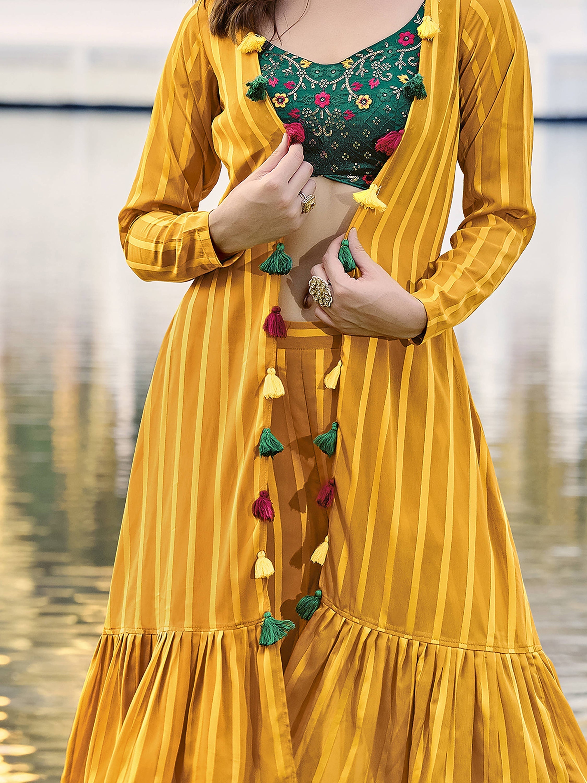Attractive yellow georgette palazzo suit with jacket featuring intricate embroidery patterns