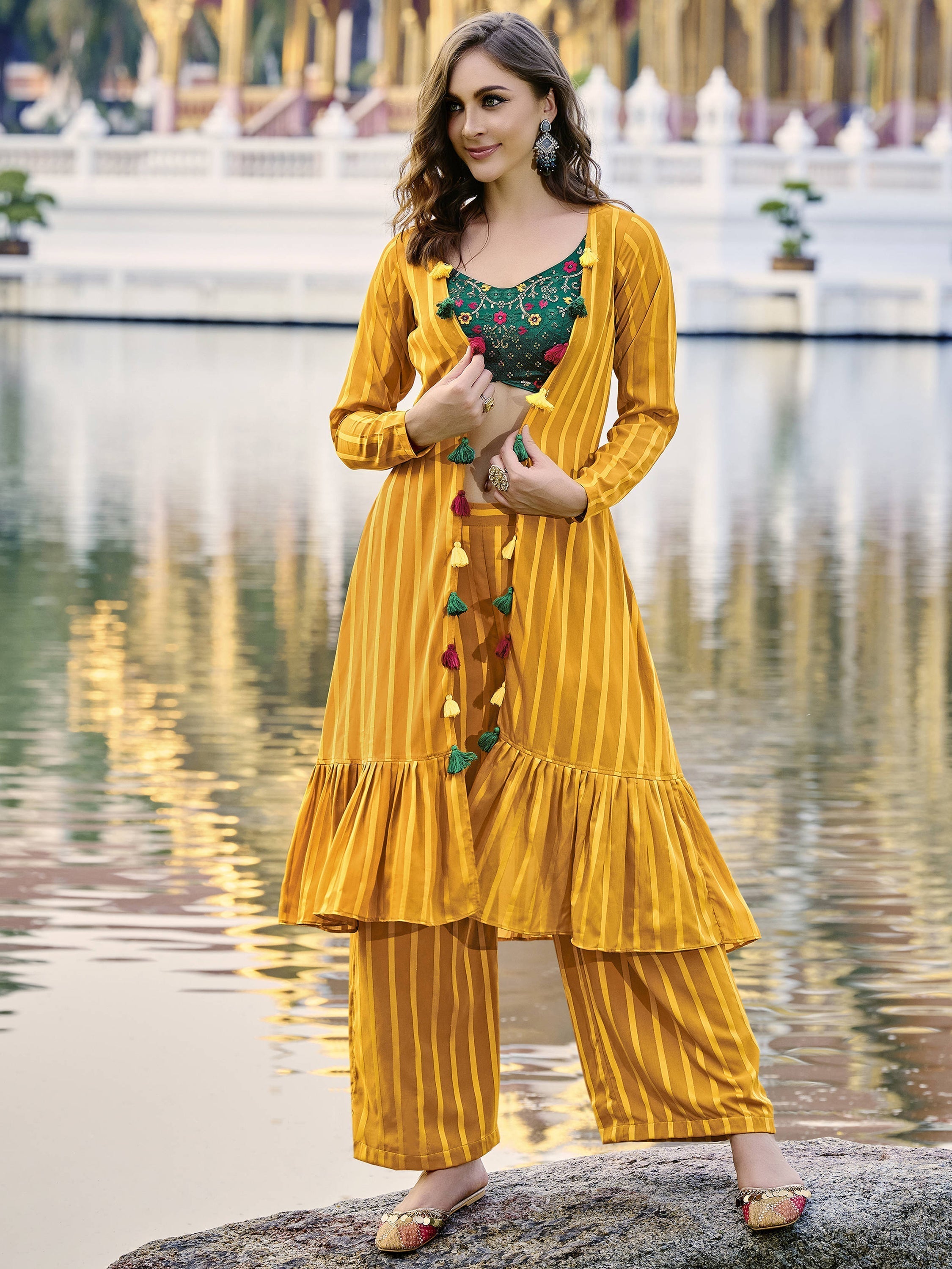 Attractive yellow georgette palazzo suit with embroidered jacket and intricate detailing