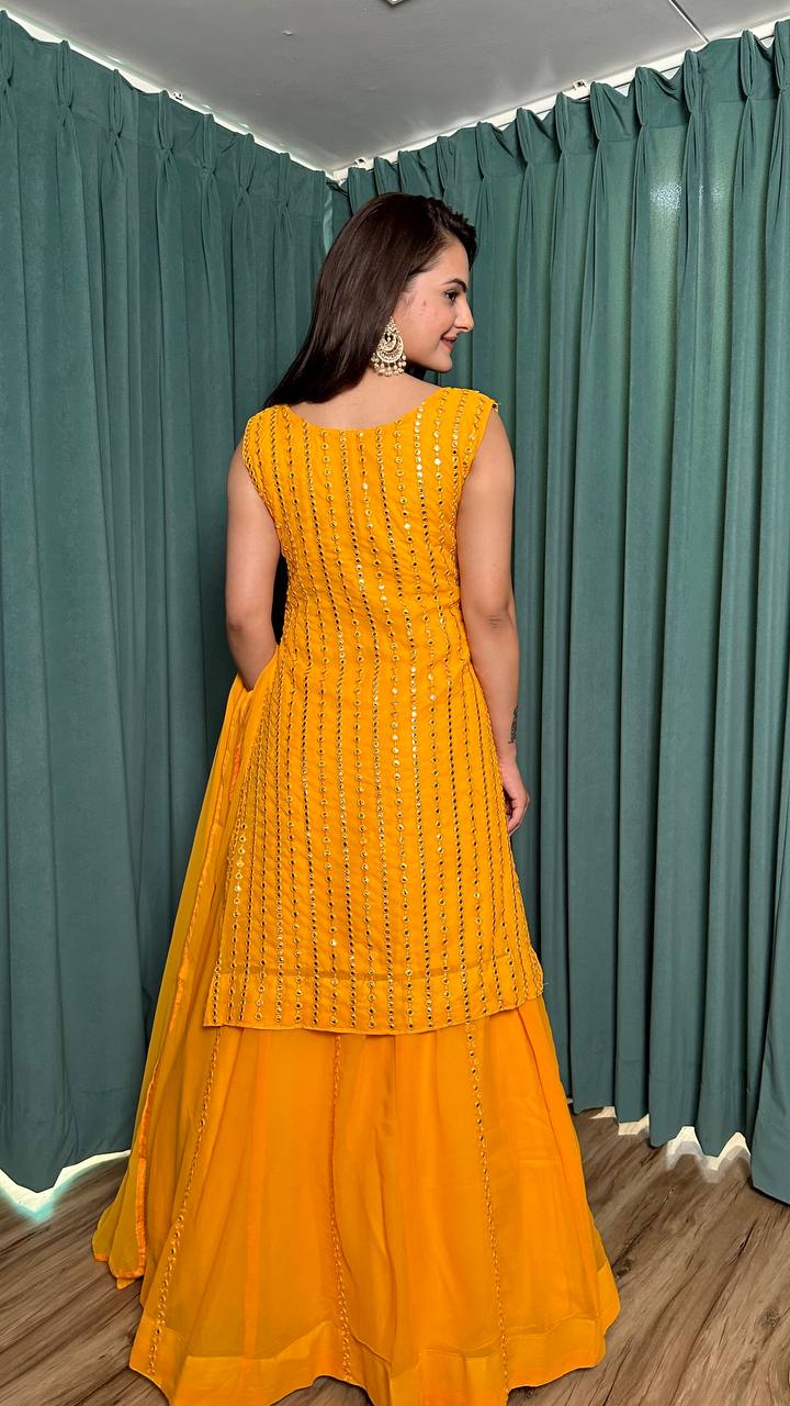  Elegant yellow georgette lehenga with intricate pagdi work and mirror detailing 