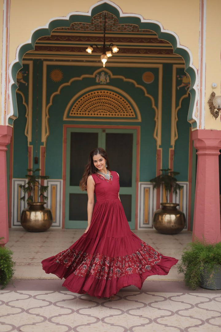 Maroon Reyon Fabric with Printed Rayon Fabric Atttached In Frill And Neck Gown