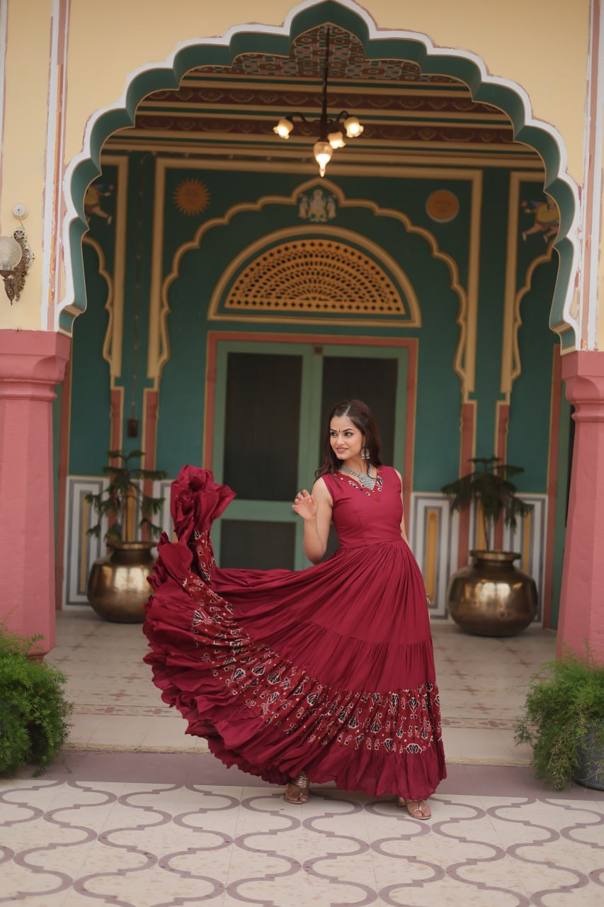 Maroon Reyon Fabric with Printed Rayon Fabric Atttached In Frill And Neck Gown