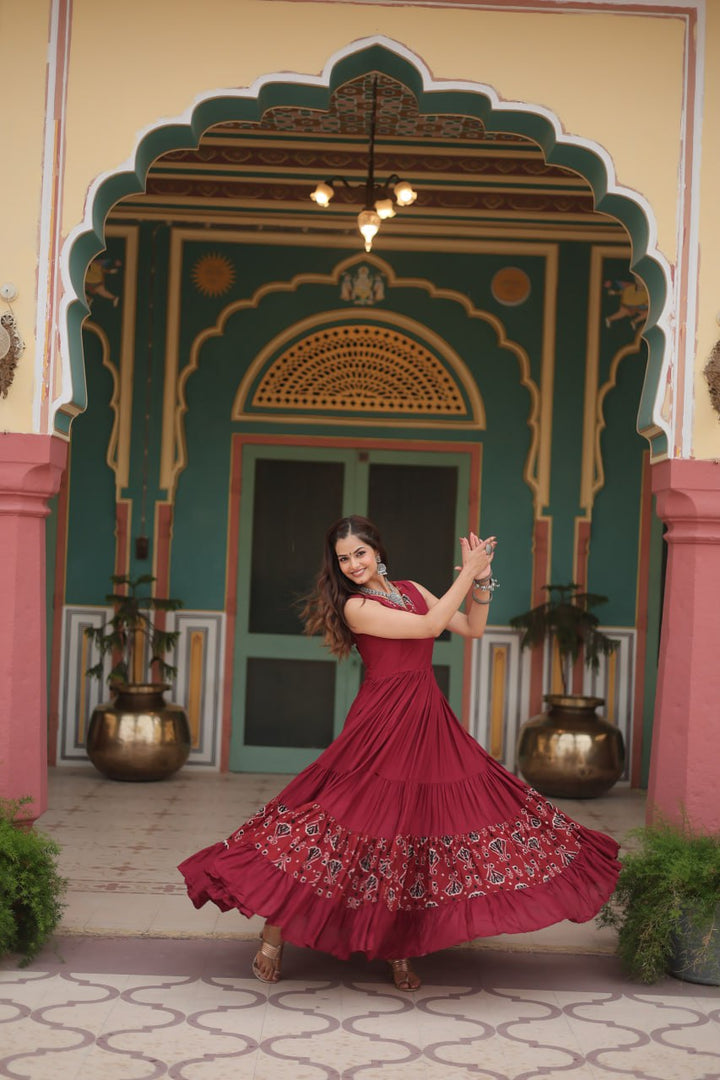 Maroon Reyon Fabric with Printed Rayon Fabric Atttached In Frill And Neck Gown