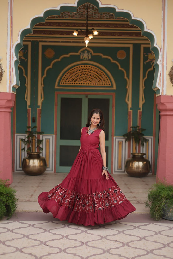 Maroon Reyon Fabric with Printed Rayon Fabric Atttached In Frill And Neck Gown