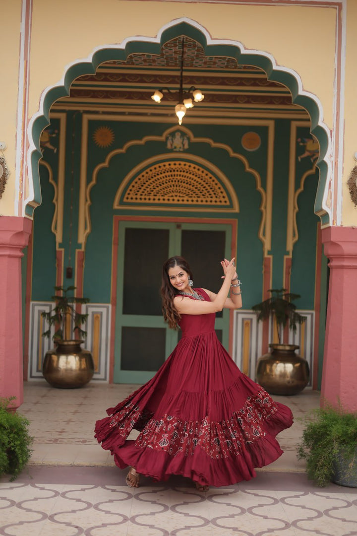 Maroon Reyon Fabric with Printed Rayon Fabric Atttached In Frill And Neck Gown