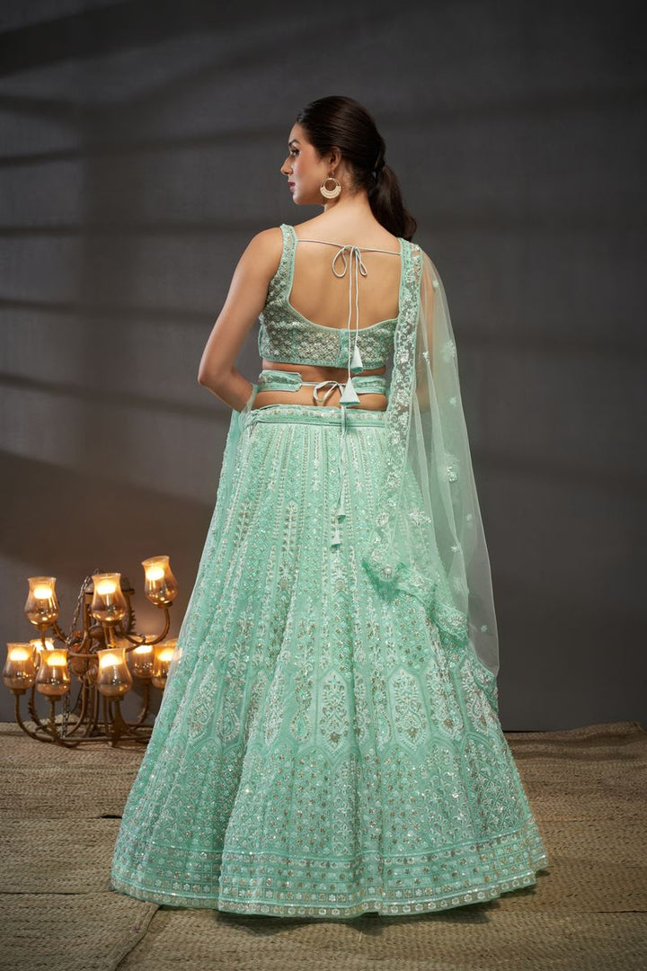 Turquoise blue Net Cutdana, Sequins and Zarkan embroidery Semi-Stitched Lehenga choli & Dupatta