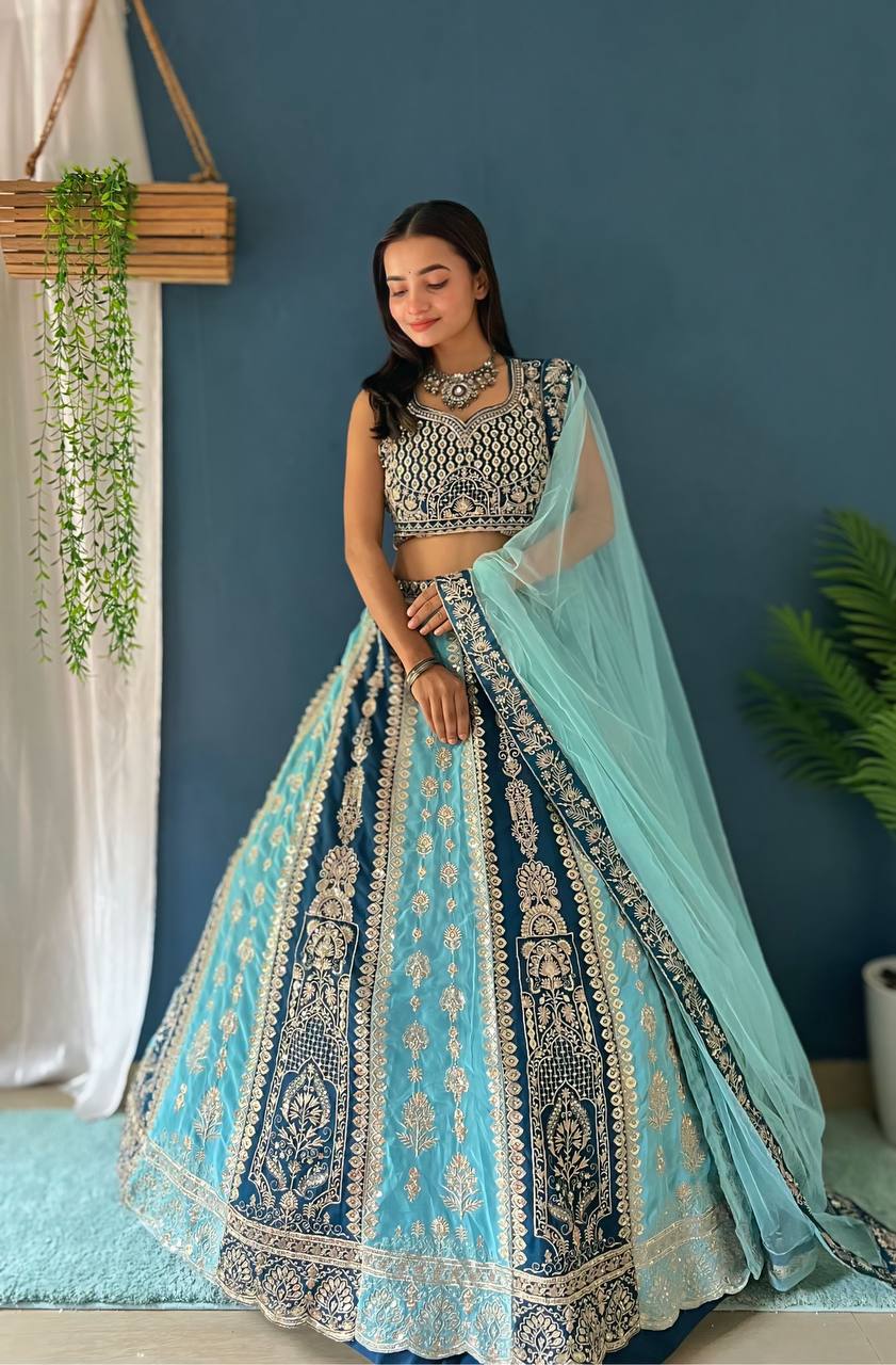 Beautiful blue faux georgette fabric with intricate embroidery, sequence, and zari design work for a stunning and elegant look