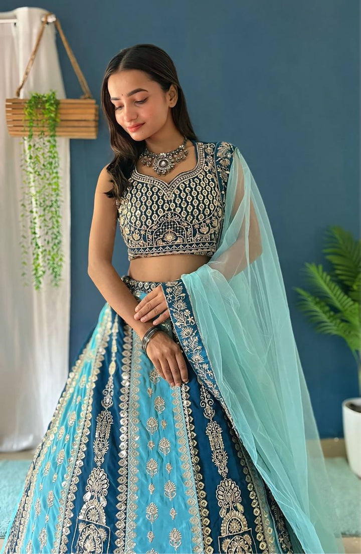 Beautiful blue faux georgette fabric with intricate embroidery, sequence, and zari design work