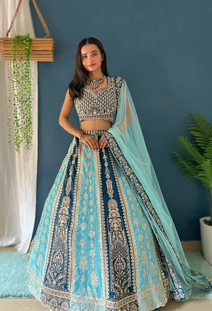 Beautiful blue faux georgette fabric adorned with intricate embroidery, sequence, and zari design work