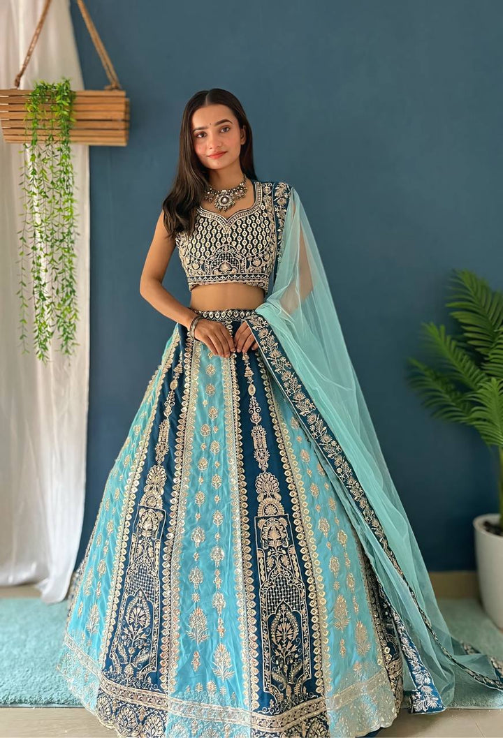 Beautiful blue faux georgette fabric adorned with intricate embroidery, sequence, and zari design work