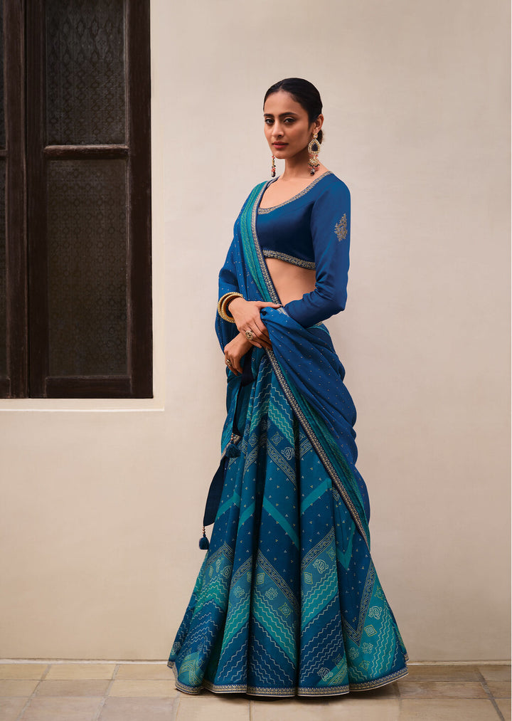 SHADES OF BLUE DIGITALLY PRINTED GAJI SILK LEHENGA WITH BORDERS & BELT EMBROIDERY