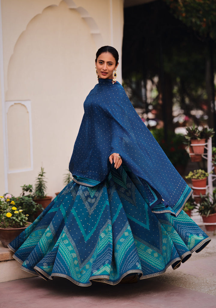 SHADES OF BLUE DIGITALLY PRINTED GAJI SILK LEHENGA WITH BORDERS & BELT EMBROIDERY