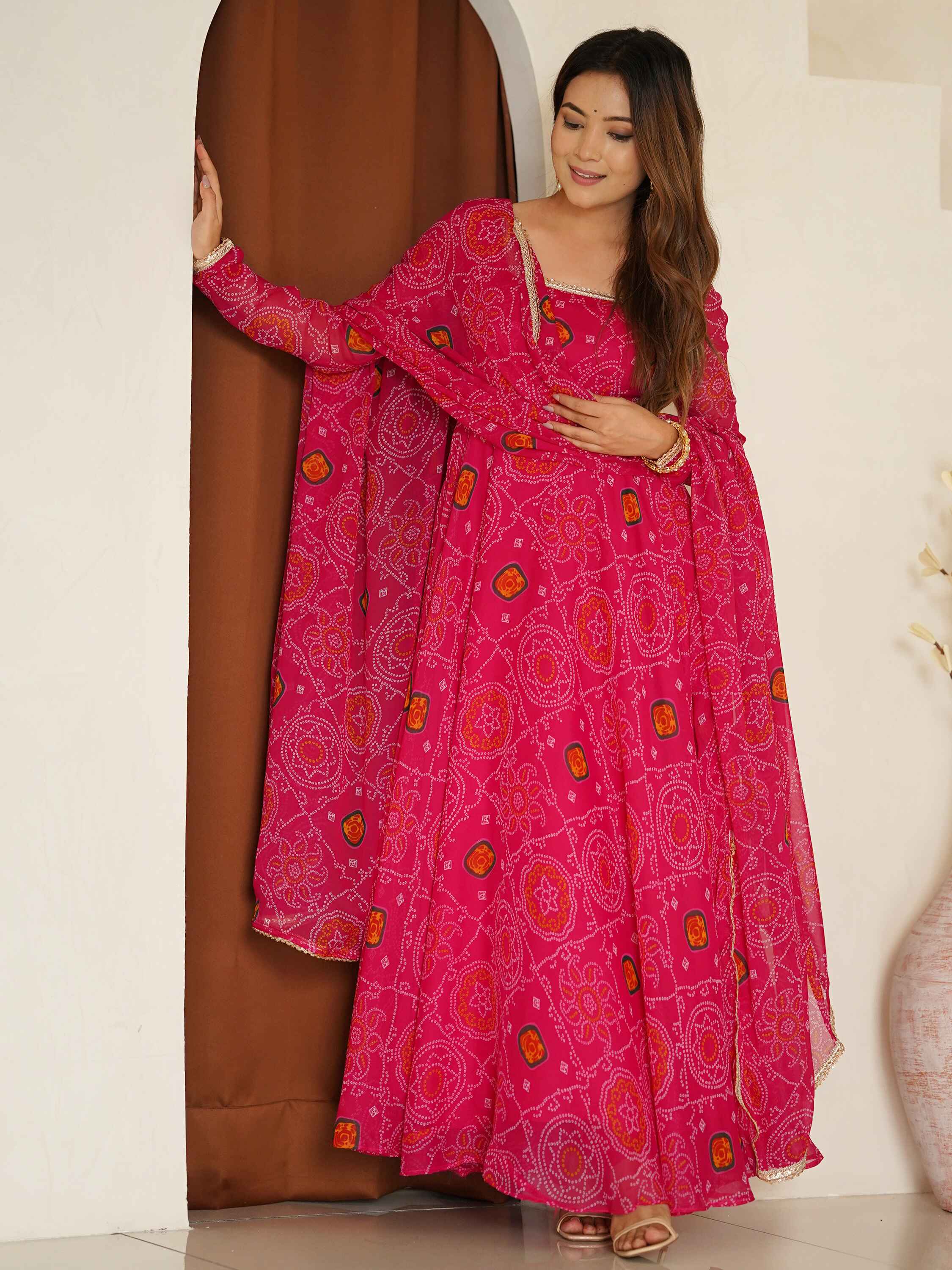 Rich pink hue and flowing silhouette creating a look of timeless sophistication