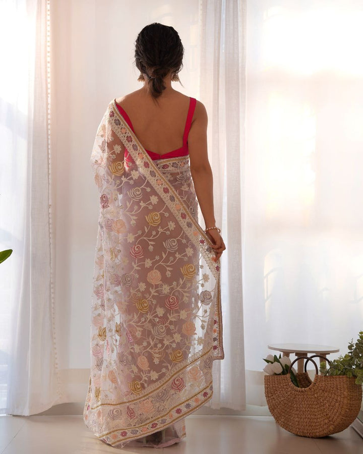 Beautiful off white saree with intricate butterfly net and aari embroidery work