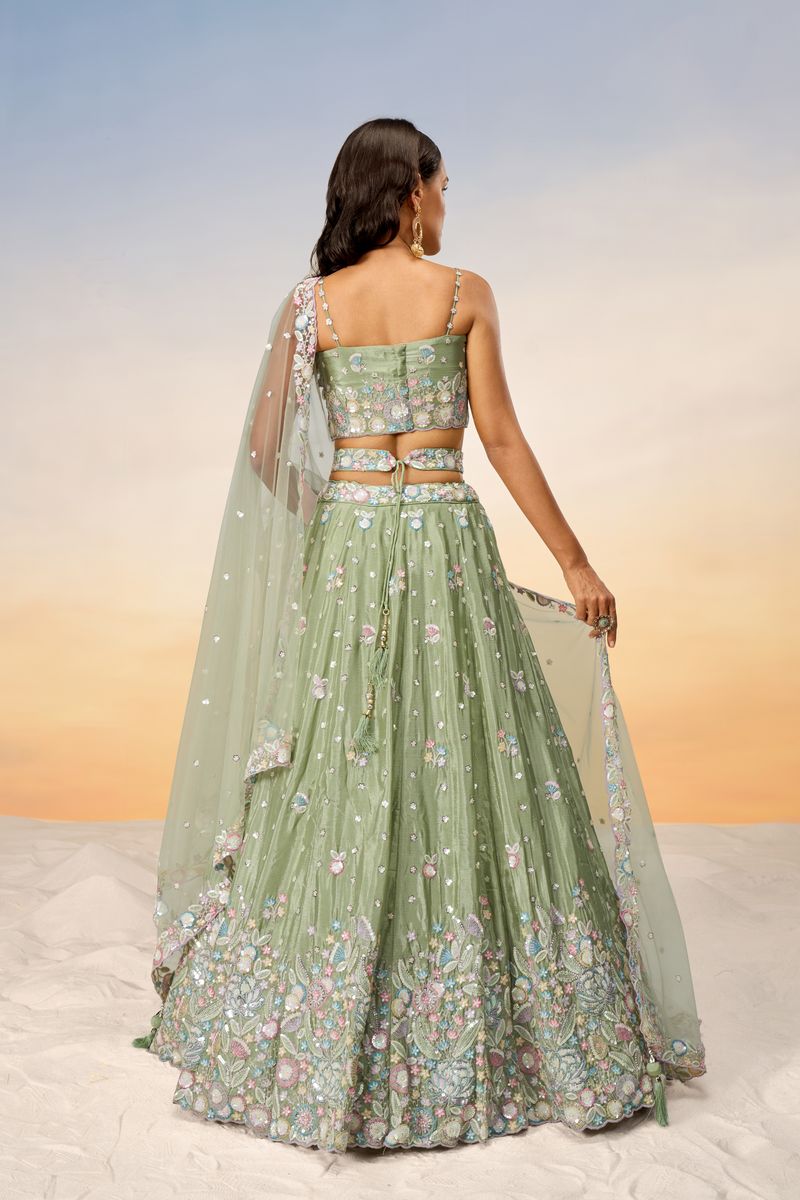 Lime green chiffon lehenga choli featuring intricate sequins and thread embroidery, paired with a matching dupatta