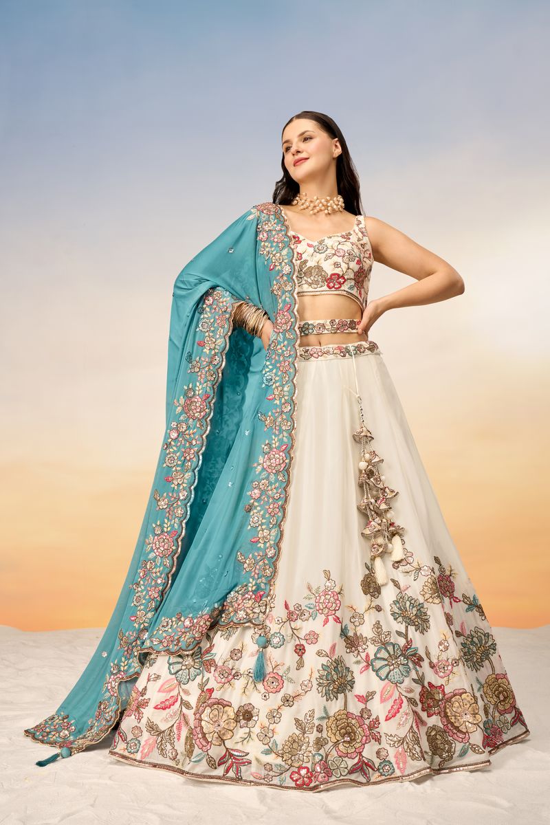 White georgette semi-stitched lehenga choli with multicolor thread, golden sequin, coding, and mirror embellishments