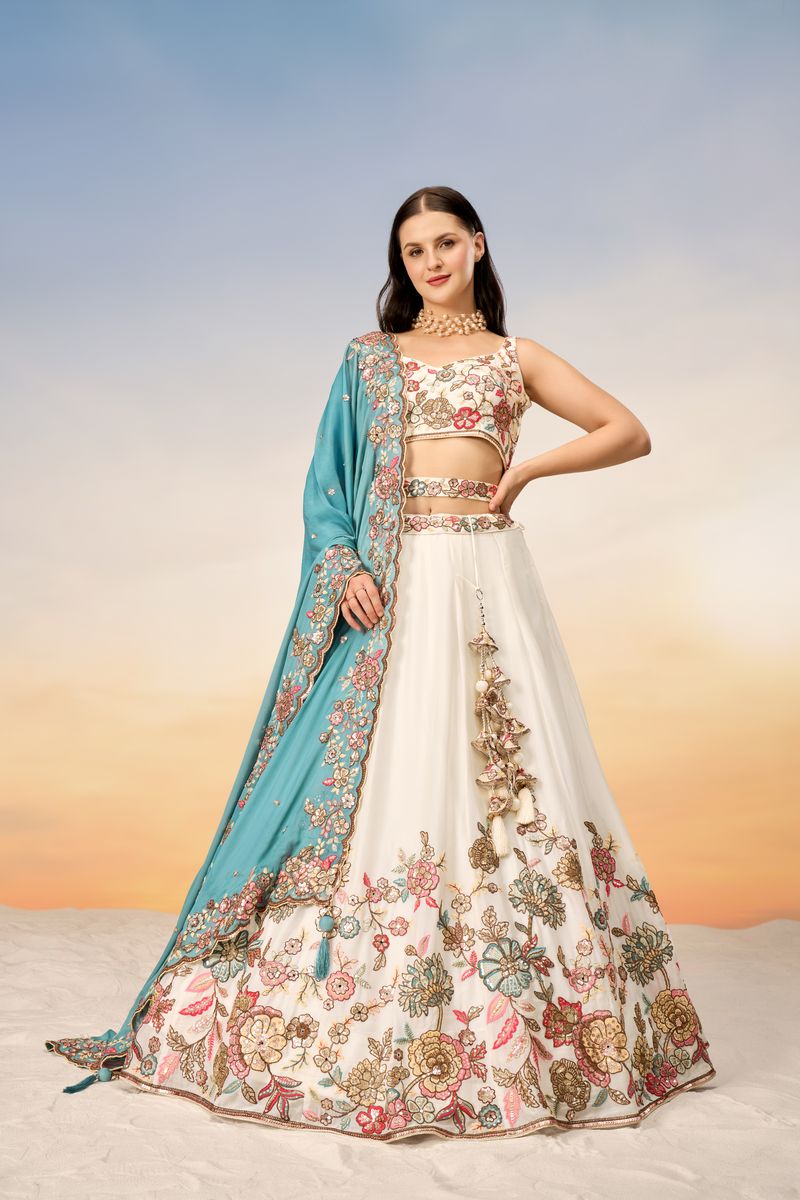 White georgette semi-stitched lehenga choli with multicolor thread, golden sequin, coding, and mirror embellishments