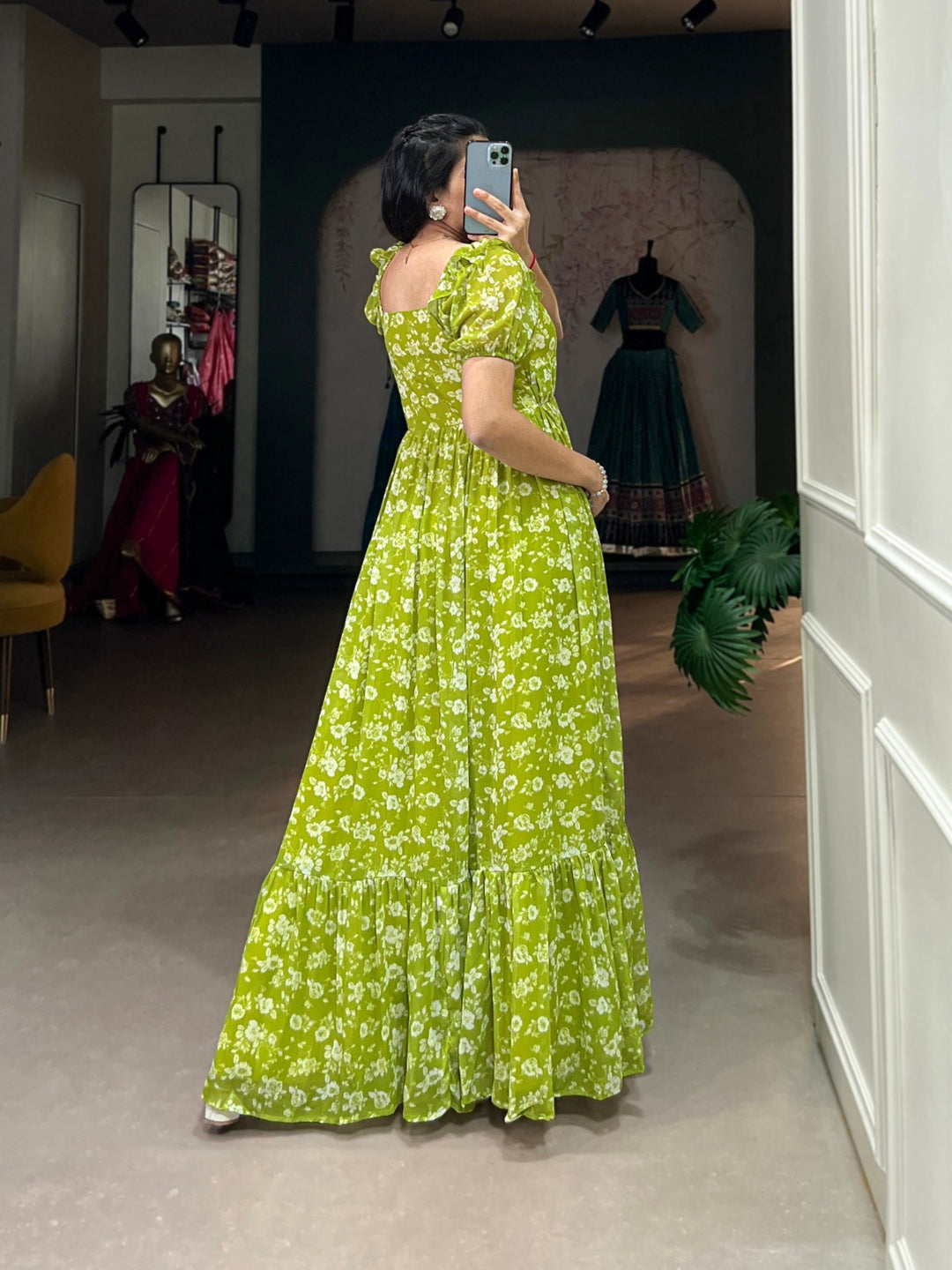 Stunning parrot green georgette gown adorned with vibrant floral pattern and flowy silhouette