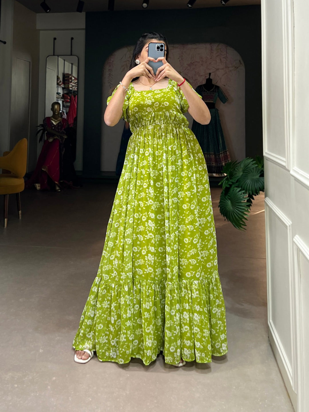 Beautiful parrot green georgette gown featuring intricate floral print and flattering silhouette