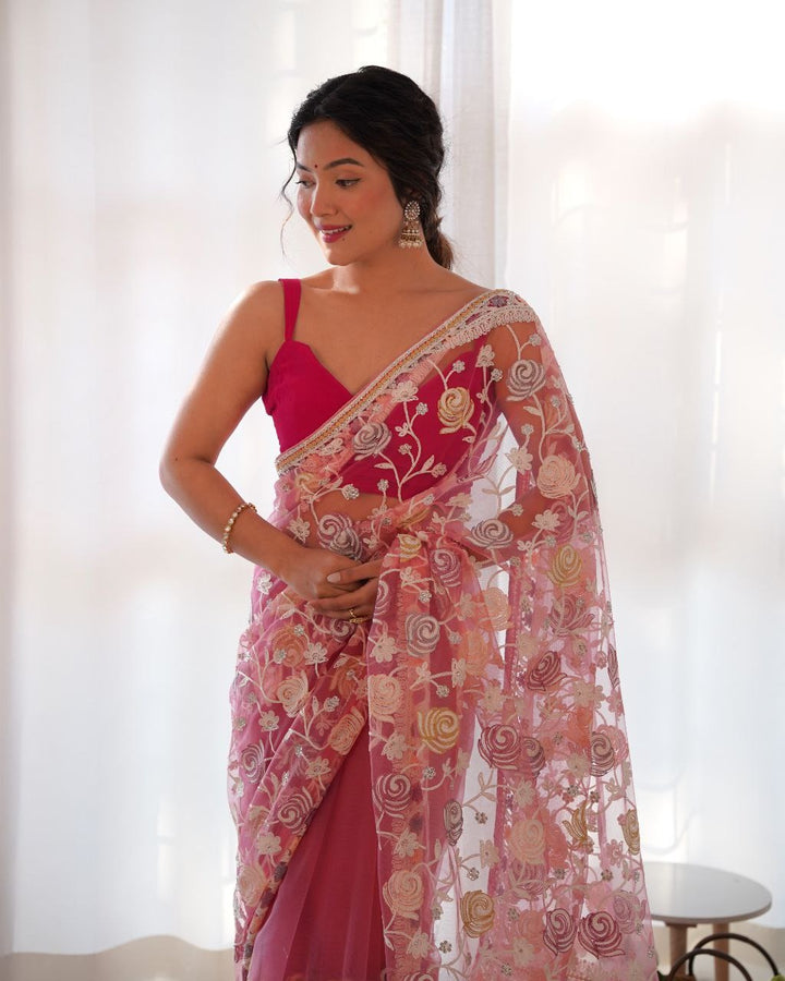 Elegant pink saree with intricate Aari embroidery and malty color thread