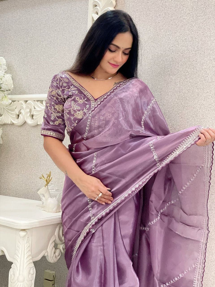 Beautifully packaged Soft Zimmy Choo Silk Designer Embroidery Work Saree In Purple Color with matching blouse piece included