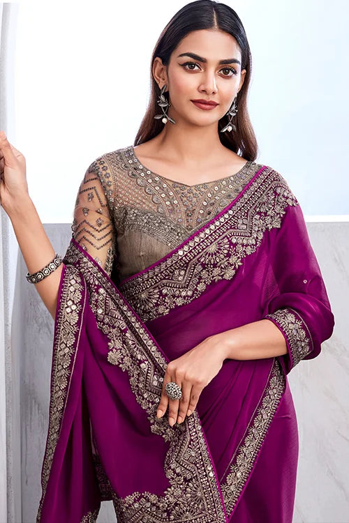 Elegant and luxurious chiffon silk purple designer saree with ornate detailing and included fancy blouse piece