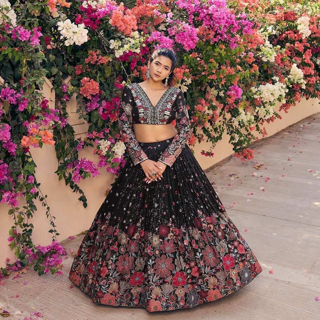 Black faux georgette lehenga with sequins and thread embroidery inspired by traditional Indian fashion