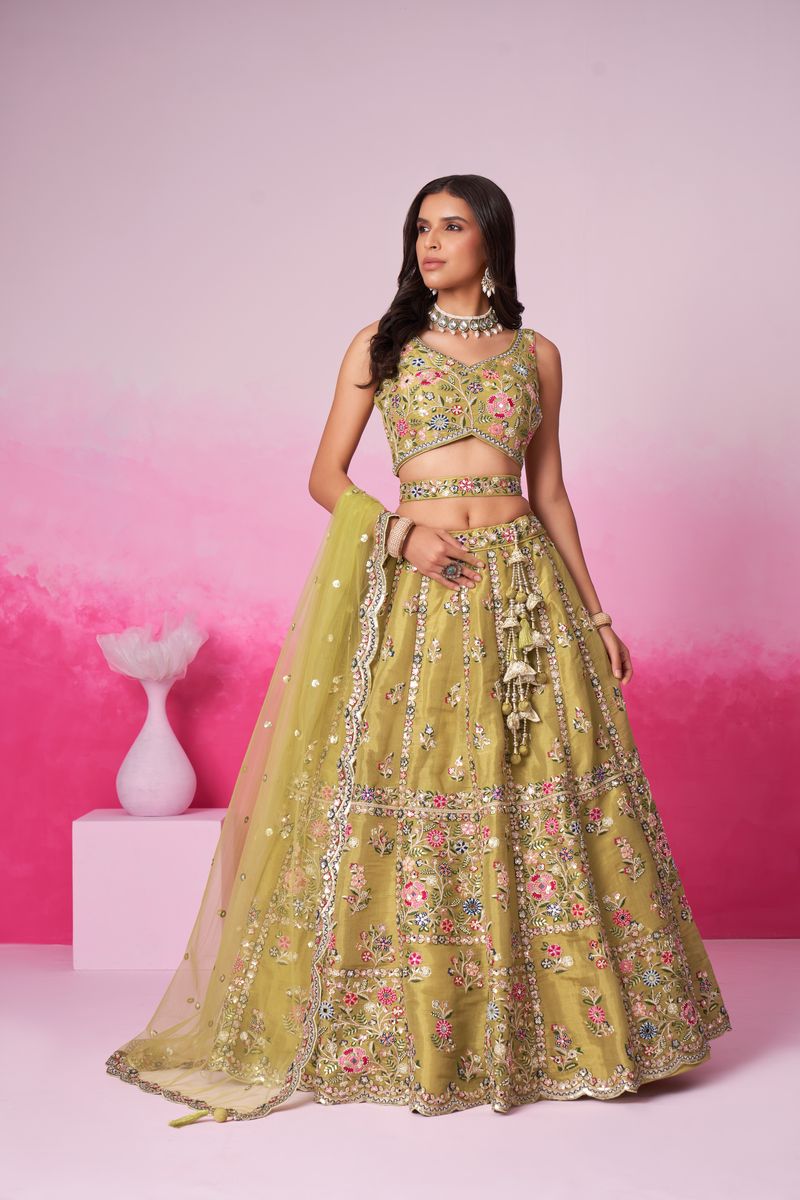 Semi-stitched bridal lehenga choli in mustard with intricate embroidery