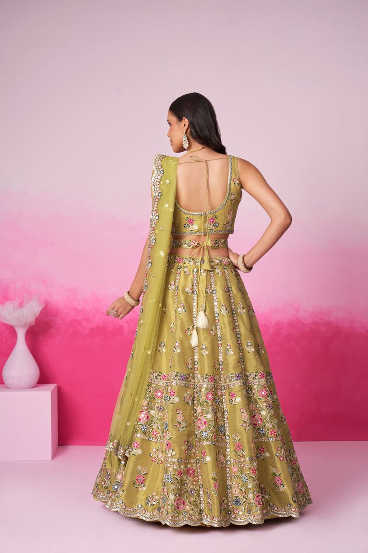 Exquisite semi-stitched bridal lehenga choli in mustard with net dupatta