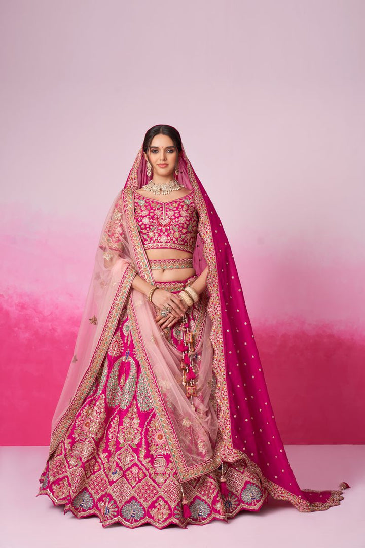 Beautiful pink silk bridal lehenga with intricate embroidery, sequins, and multi-color thread, paired with double dupatta