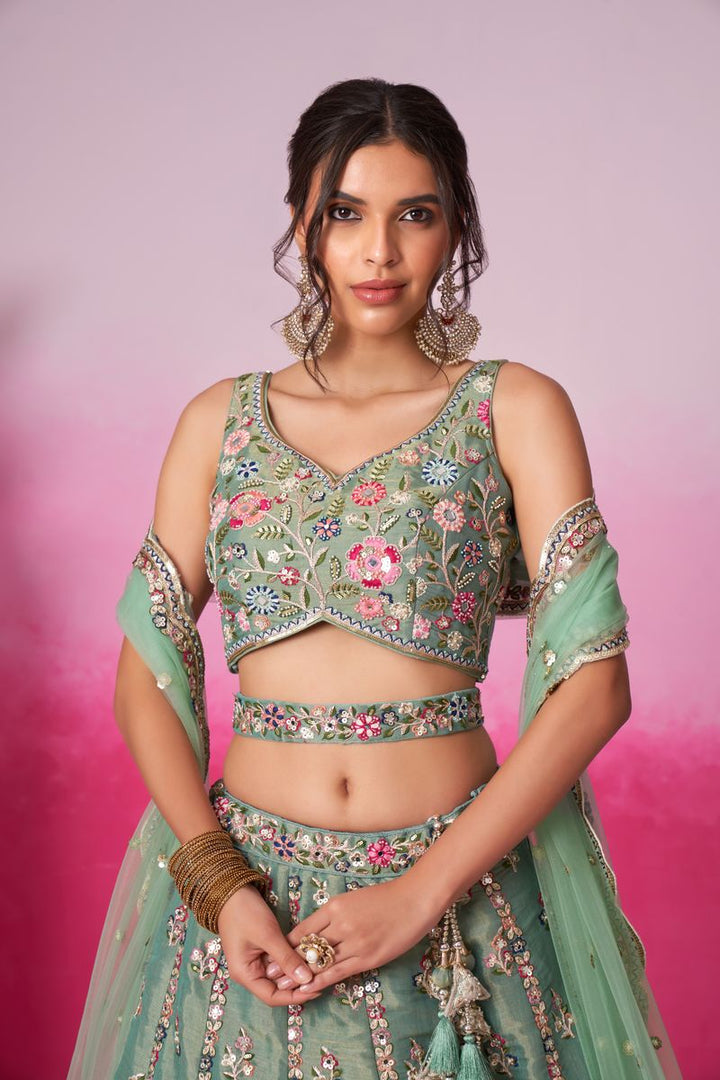  Semi-stitched Bridel Lehenga choli in sea green with intricate Moti and sequins embroidery, paired with matching Dupatta