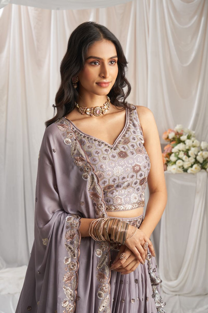 Gorgeous mauve Georgette lehenga choli and dupatta ensemble with sequin detailing