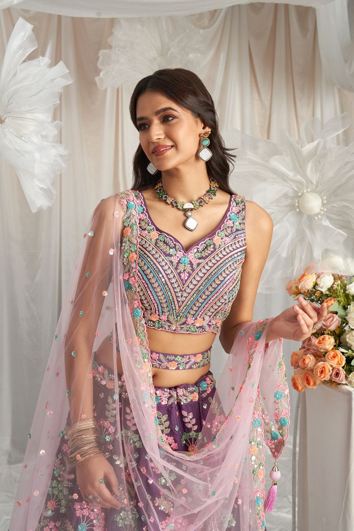 Exquisite Purple Georgette Lehenga Choli with Sequined and Zarkan Embroidery