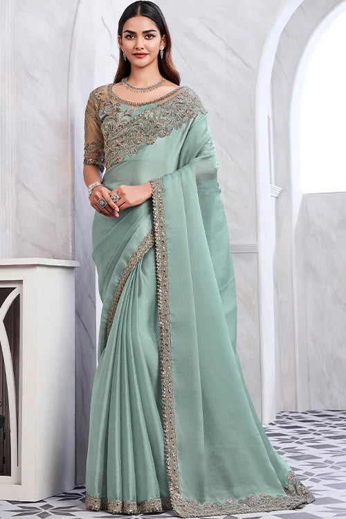 Bridal sea-green saree with intricate embroidery and matching designer blouse piece