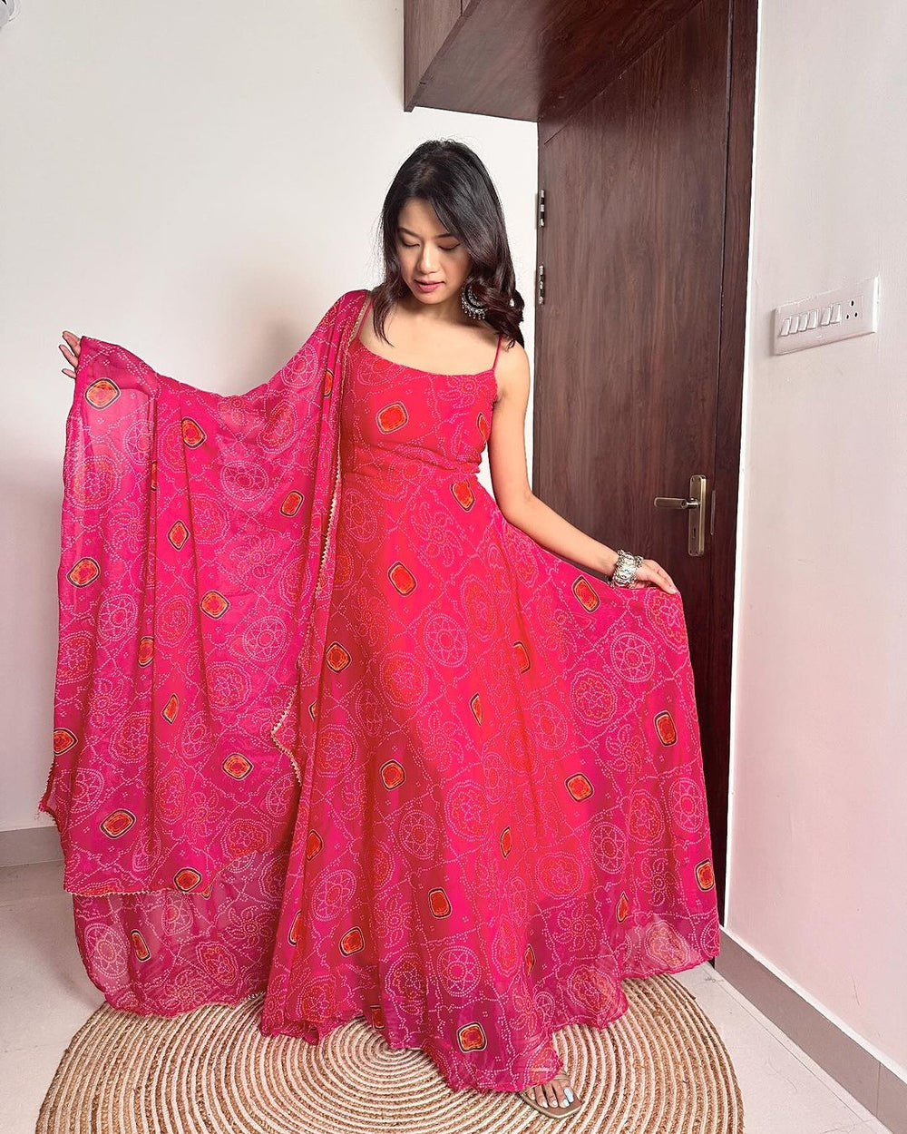 Elegant and stylish pink Bandhani print Anarkali gown made from soft chiffon fabric, designed by Qivii for a luxurious look