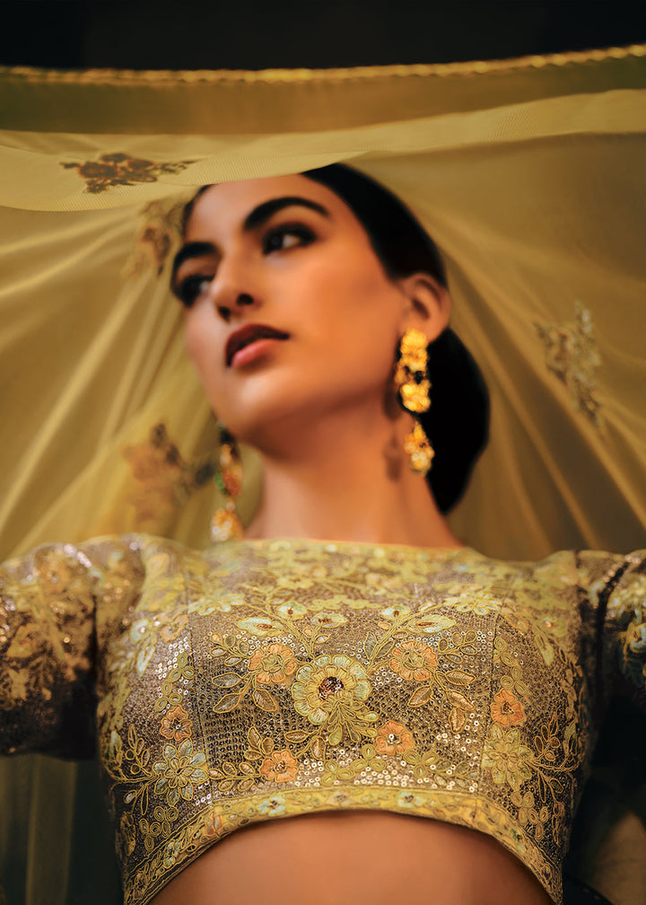 Shades Of Yellow Heavy Embroidered Net Lehenga Choli  - By Qivii