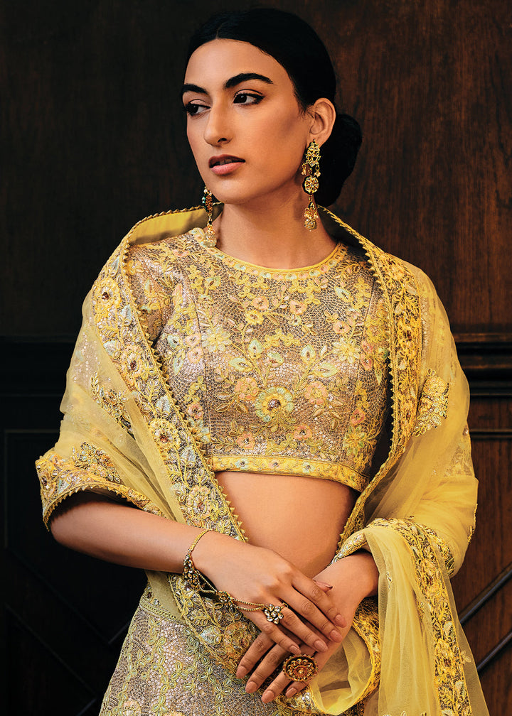 Shades Of Yellow Heavy Embroidered Net Lehenga Choli  - By Qivii