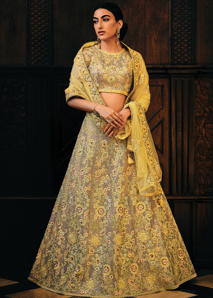 Shades Of Yellow Heavy Embroidered Net Lehenga Choli  - By Qivii