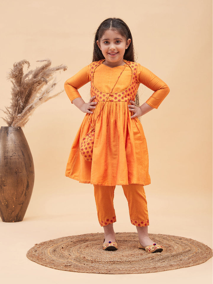 VASTRAMAY Girls Orange Anarkali Kurta Pyjama Set With Potli Bag