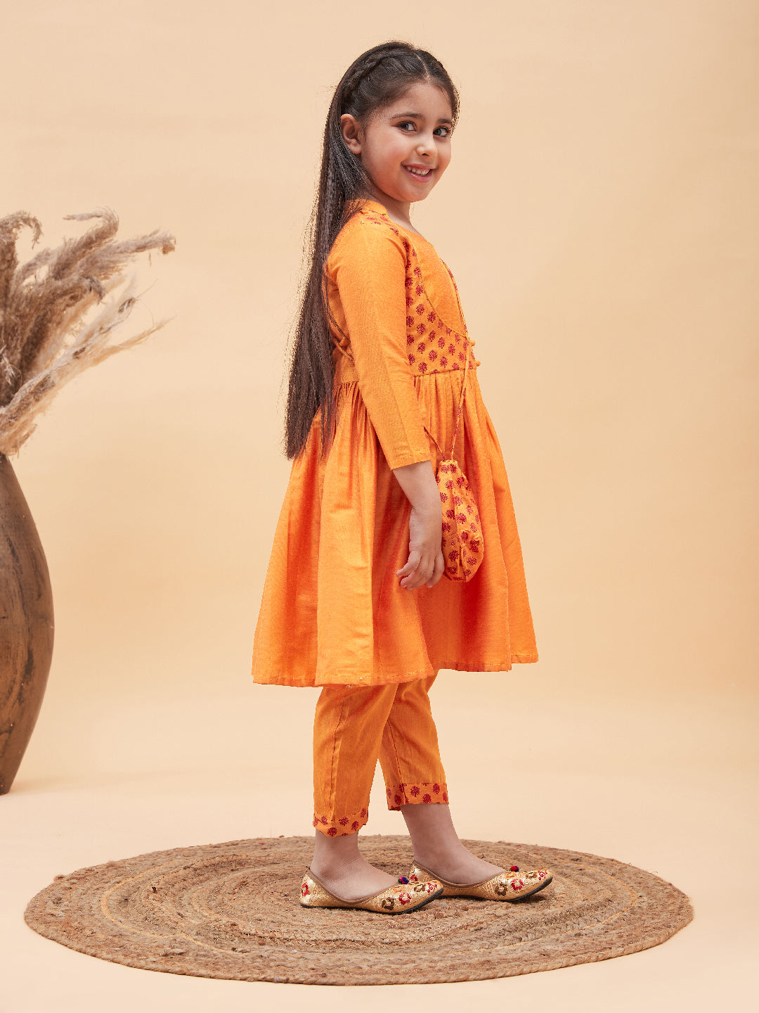 VASTRAMAY Girls Orange Anarkali Kurta Pyjama Set With Potli Bag