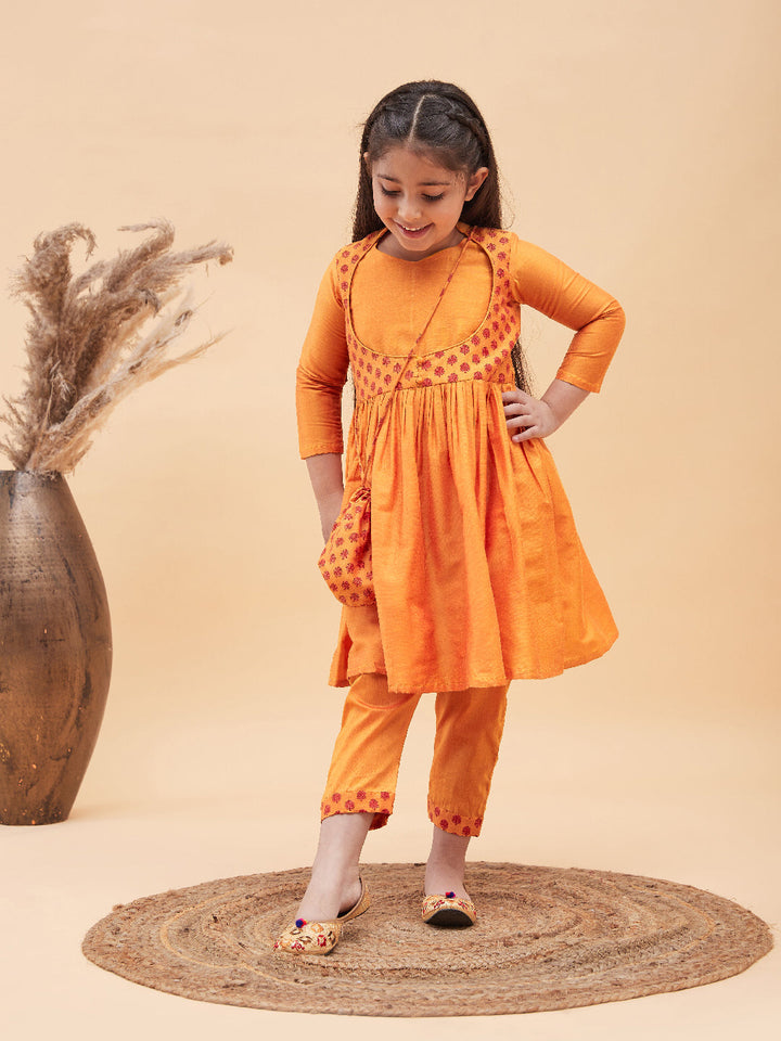 VASTRAMAY Girls Orange Anarkali Kurta Pyjama Set With Potli Bag