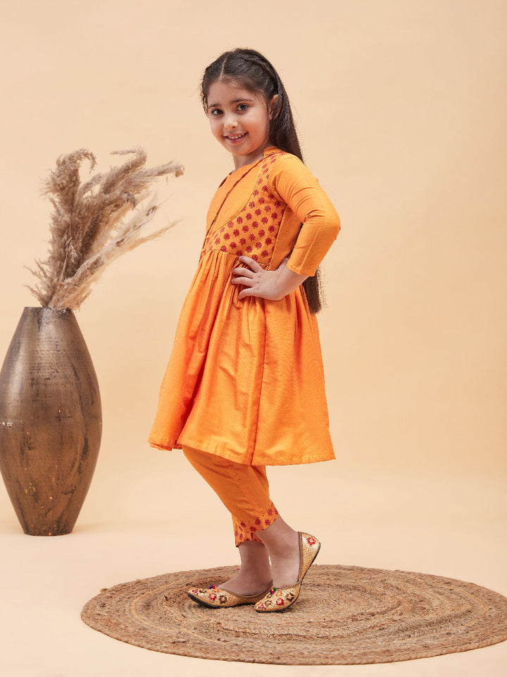 VASTRAMAY Girls Orange Anarkali Kurta Pyjama Set With Potli Bag