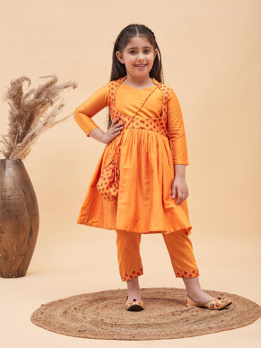 VASTRAMAY Girls Orange Anarkali Kurta Pyjama Set With Potli Bag